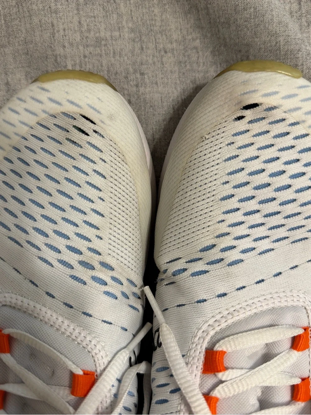 Nike White Running Sneakers with Orange Accents and Purple Lining